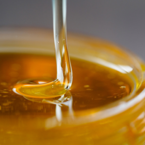 Close-up of Honey Being Poured Into a Jar