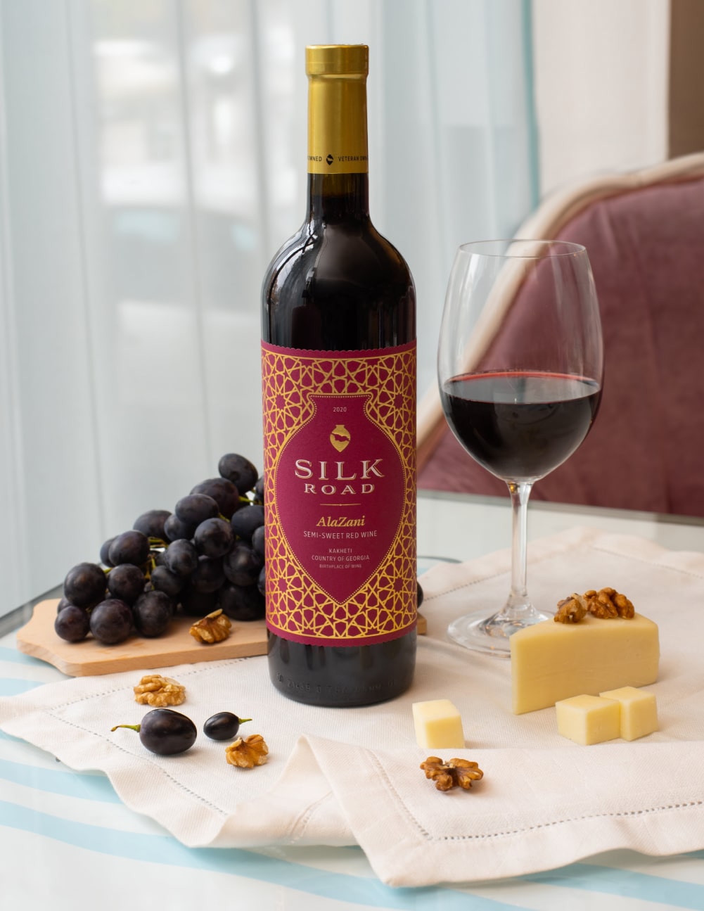 Bottle of Semi-Sweet Georgian Red Wine Alazani Served with Grapes and Cheese