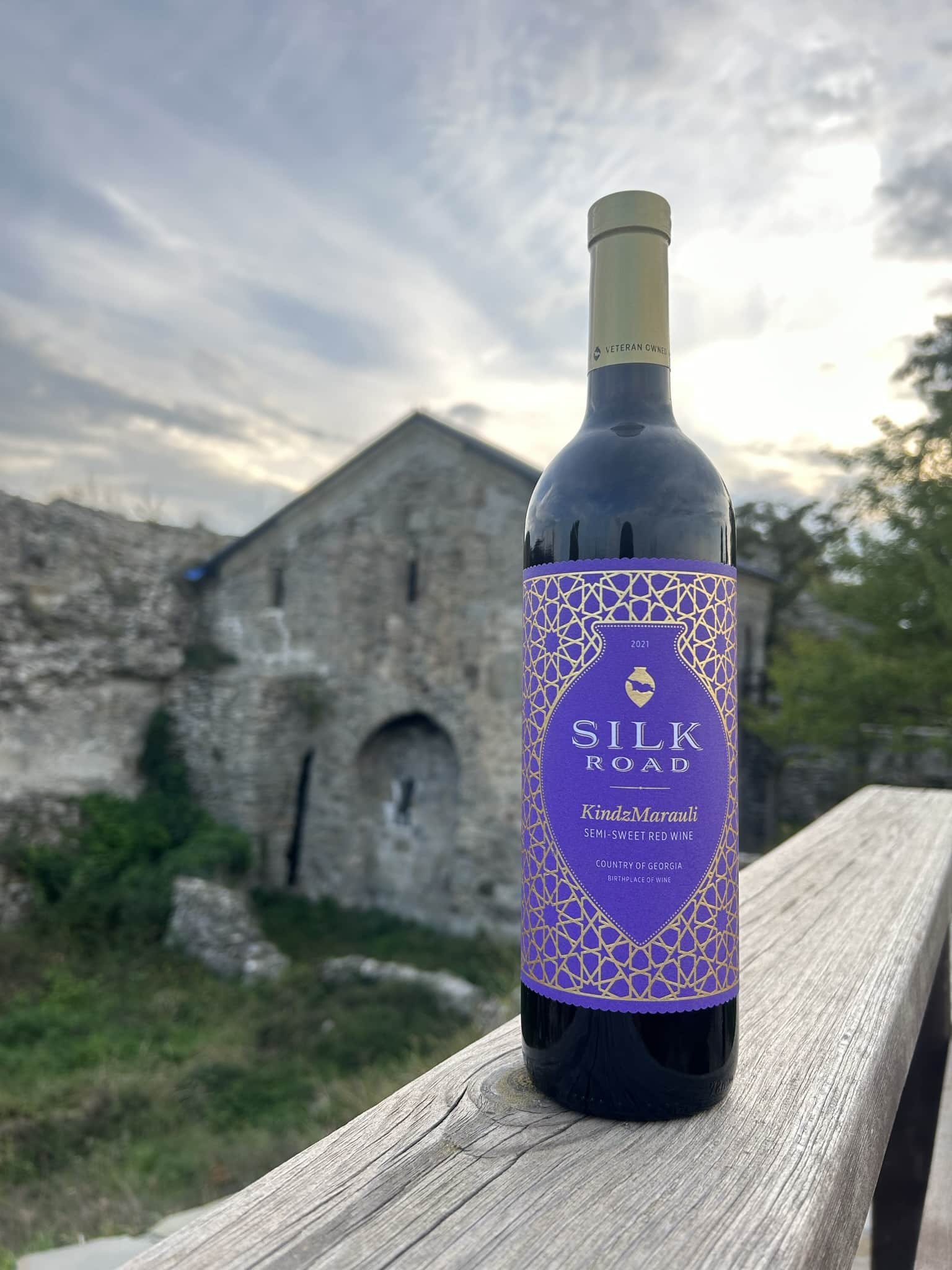 Bottle of Kindzmarauli Wine at a Rural Background